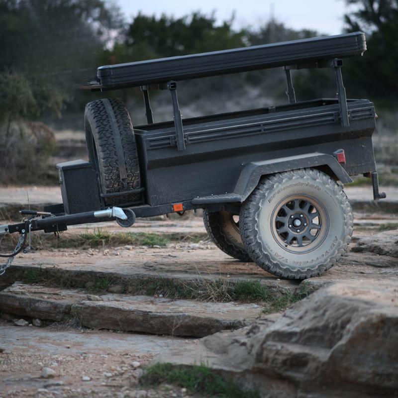 overland-vehicle-systems-off-road-trailer-side-view-with-closed-roof-top-tent-in-nature