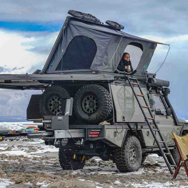 ovs-sidewinder-hard-shell-roof-top-open-front-corner-view-on-toyota-land-cruiser-in-nature