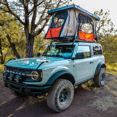 badass-tents-recon-pop-up-roof-top-tent-open-front-corner-view-on-ford-bronco