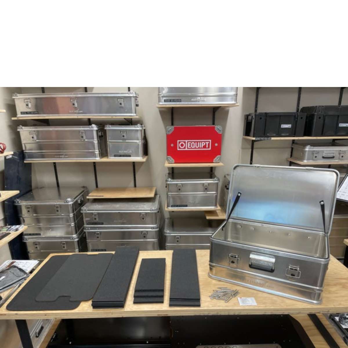 alubox-case-divider-system-black-side-view-with-aluminum-case-on-table