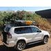 eez-awn-k9-roof-rack-for-lexus-gx-side-view-with-tent-with-building-and-shrub-on-background