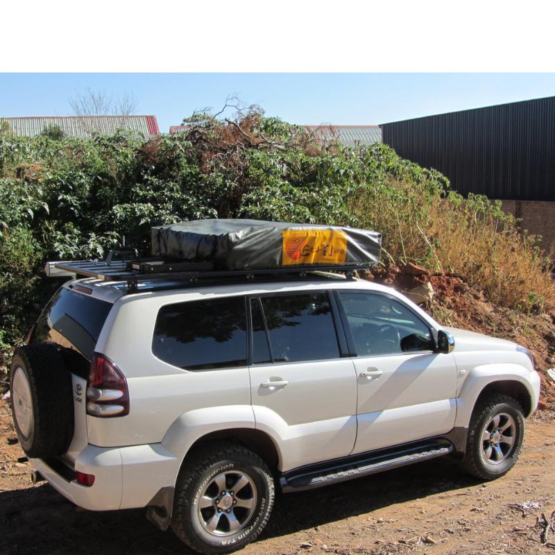 eez-awn-k9-roof-rack-for-lexus-gx-side-view-with-tent-with-building-and-shrub-on-background