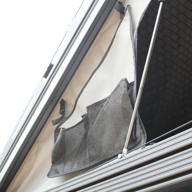 eezi-awn-blade-40th-edition-hard-shell-roof-top-tent-open-close-up-view-with-mesh-pocket