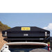 eezi-awn-blade-hard-shell-roof-top-tent-closed-rear-view-on-vehicle-in-nature