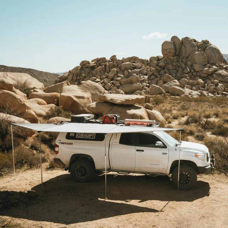 eezi-awn-dragonfly-180-open-beige-side-view-on-toyota-tundra-in-terrain