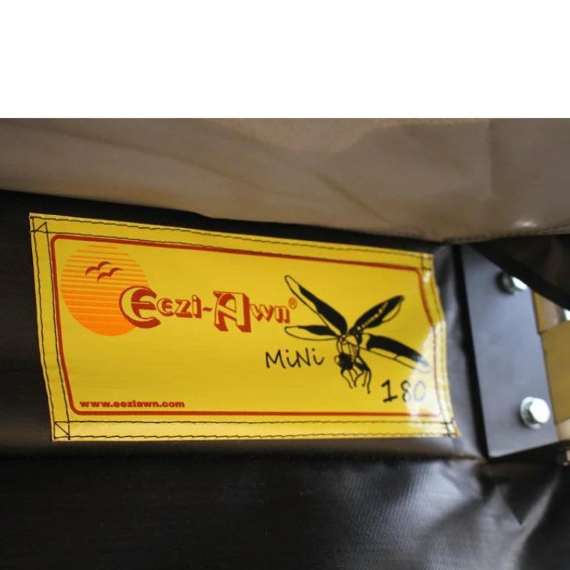 eezi-awn-dragonfly-mini-180-awning-beige-open-rear-interior-close-up-view-with-brand-logo