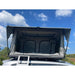 eezi-awn-galaxy-soft-shell-rooftop-tent-open-close-up-view-on-toyota-land-cruiser-view-in-nature