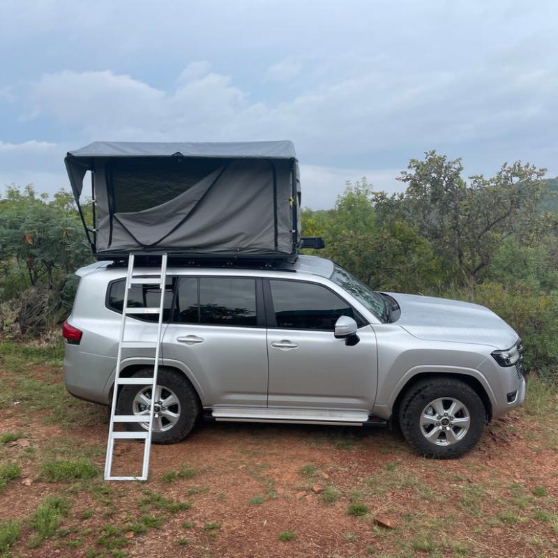 eezi-awn-galaxy-soft-shell-rooftop-tent-open-front-view-on-toyota-land-cruiser-view-in-nature