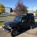 eezi-awn-k9-roof-rack-for-jeep-wrangler-jl-front-corner-view-with-tent-in-parking-area