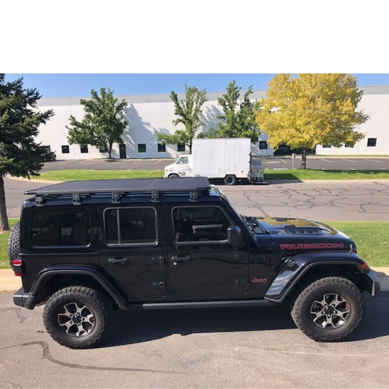 eezi-awn-k9-roof-rack-for-jeep-wrangler-jl-side-view-with-truck-on-background-in-parking-area