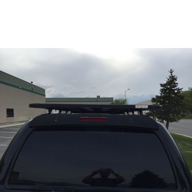 eezi-awn-k9-roof-rack-for-toyota-4runner-3rd-gen-rear-view-with-building-on-background