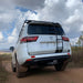 eezi-awn-k9-roof-rack-for-toyota-land-cruiser-300-series-rear-view-in-nature