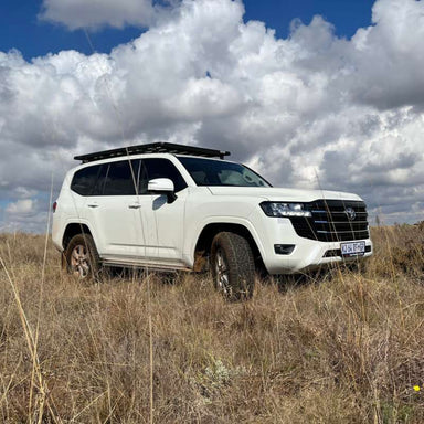 eezi-awn-k9-roof-rack-for-toyota-land-cruiser-300-series-side-view-in-nature
