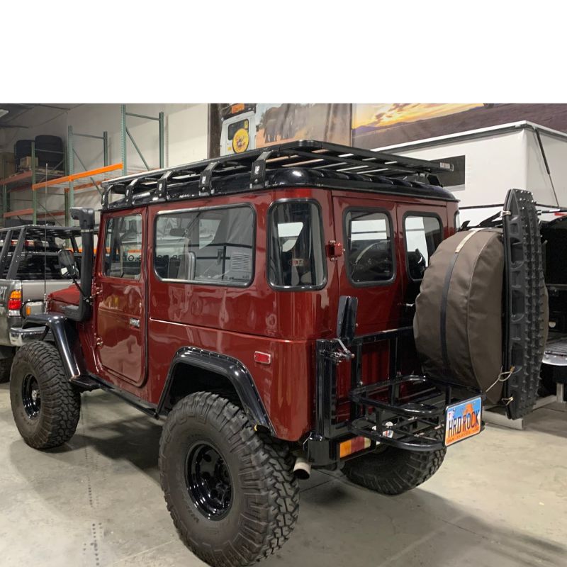 eezi-awn-k9-roof-rack-for-toyota-land-cruiser-40-series-rear-view-with-tire-and-maxtrax-inside-shop