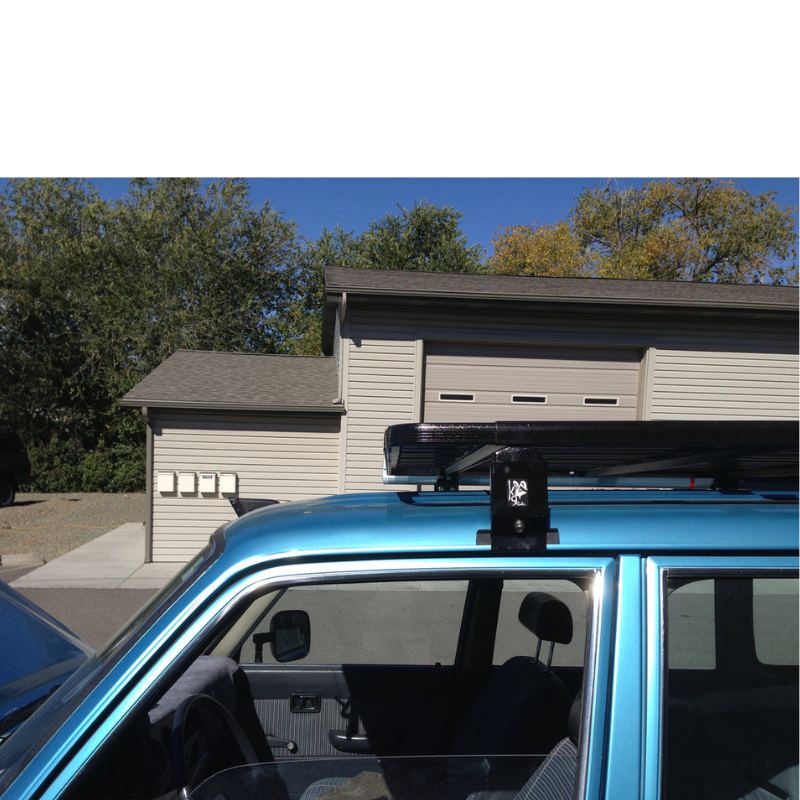 eezi-awn-k9-roof-rack-for-toyota-land-cruiser-60-close-up-view-with-logo-in-parking-space