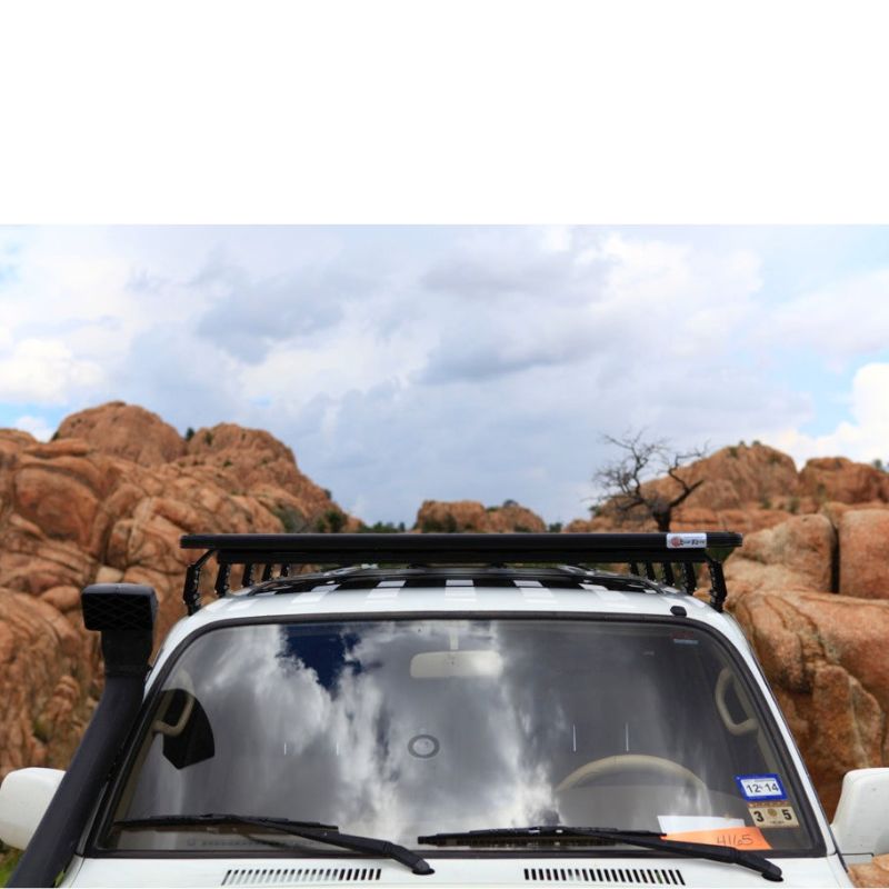 eezi-awn-k9-roof-rack-for-toyota-land-cruiser-80-series-front-view-in-terrain