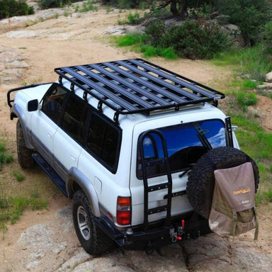 eezi-awn-k9-roof-rack-for-toyota-land-cruiser-80-series-rear-corner-view-with-spare-tire-in-nature