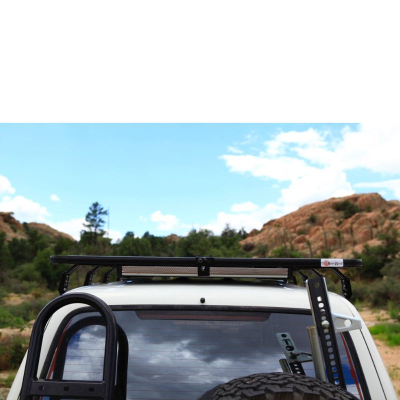 eezi-awn-k9-roof-rack-for-toyota-land-cruiser-80-series-rear-view-in-terrain