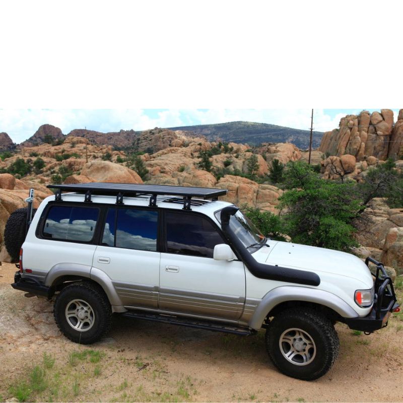 eezi-awn-k9-roof-rack-for-toyota-land-cruiser-80-series-side-view-in-terrain