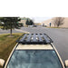 eezi-awn-k9-roof-rack-for-toyota-tacoma-close-up-view-with-vehicles-and-building-on-background