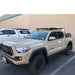 eezi-awn-k9-roof-rack-for-toyota-tacoma-with-front-corner-view-with-truck-and-building-on-the-back