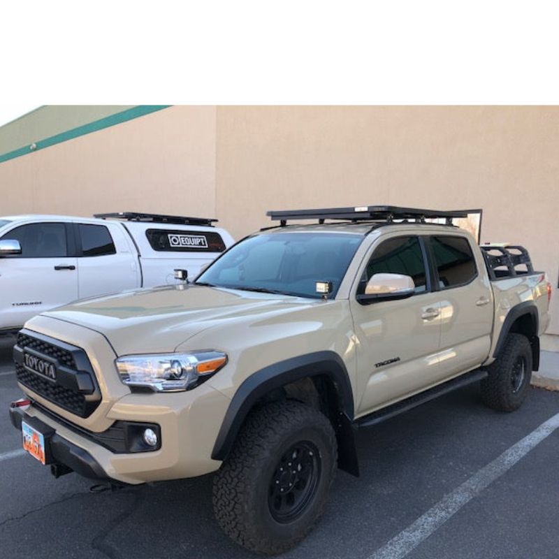eezi-awn-k9-roof-rack-for-toyota-tacoma-with-front-corner-view-with-truck-and-building-on-the-back