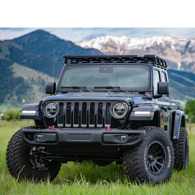 eezi-awn-k9-roof-rack-kit-for-jeep-gladiator-front-view-with-mountain-at-the-back-in-nature