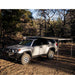 eezi-awn-lite-awning-beige-open-side-view-on-toyota-4runner-in-terrain