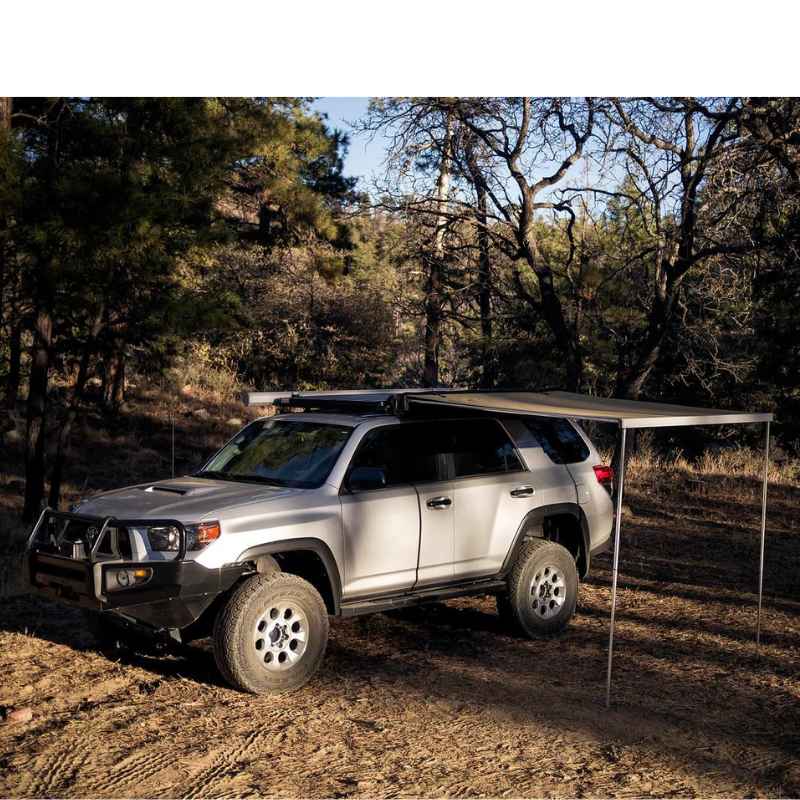 eezi-awn-lite-awning-beige-open-side-view-on-toyota-4runner-in-terrain