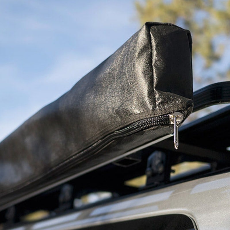 eezi-awn-lite-awning-close-rear-corner-view-with-enclosure-on-vehicle-in-nature