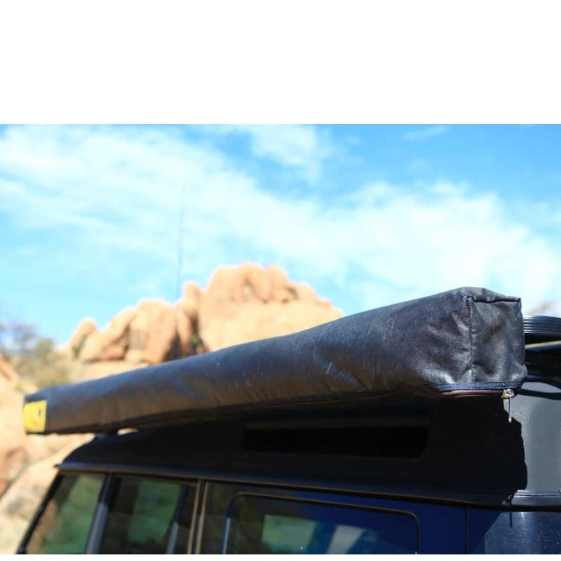 eezi-awn-manta-270-awning-beige-close-with-enclosure-back-corner-side-view-on-land-cruiser-in-nature