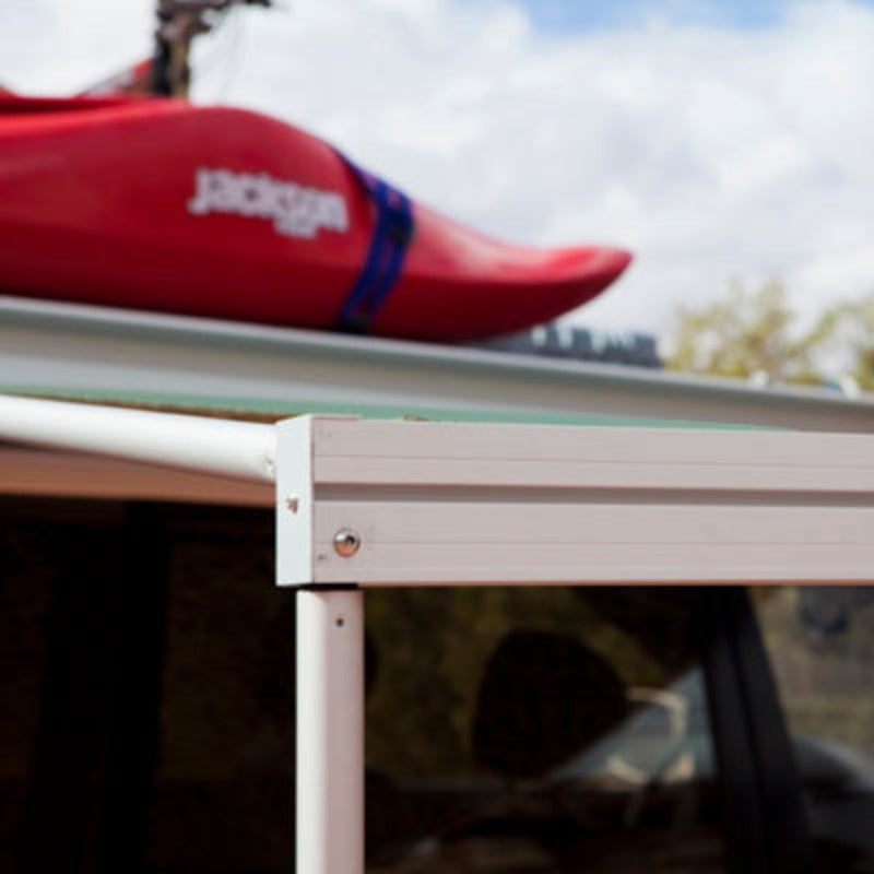 eezi-awn-series-1000-awning-beige-open-side-view-aluminum-frame-in-nature