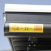 eezi-awn-series-2000-awning-close-close-up-view-black-hardcase-with-brand-logo-beside-hard-shell-tent-on-vehicle-in-nature