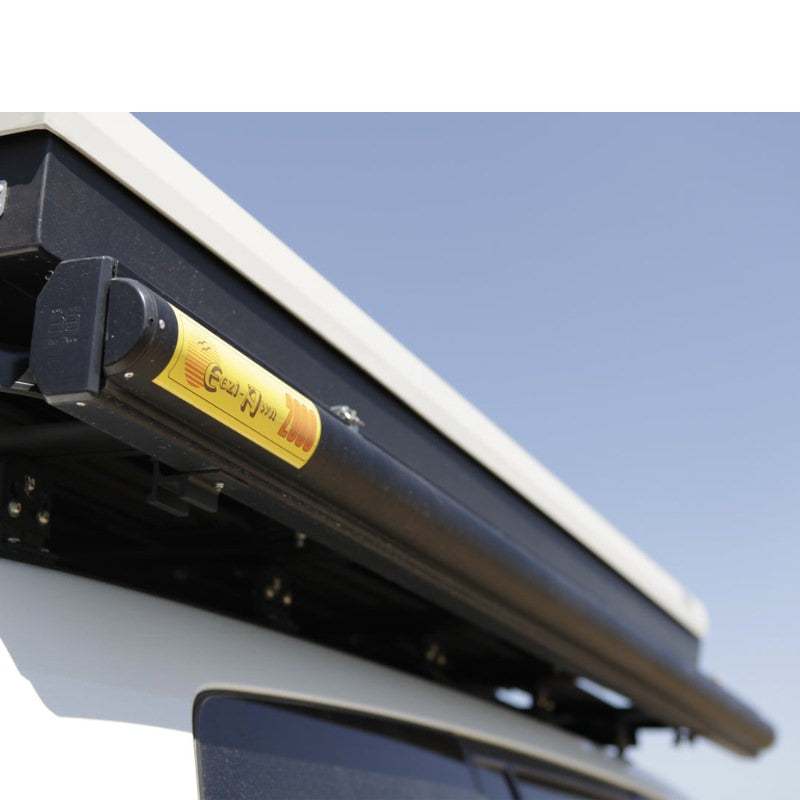 eezi-awn-series-2000-awning-close-side-view-black-hardcase-beside-hard-shell-tent-on-vehicle-in-nature