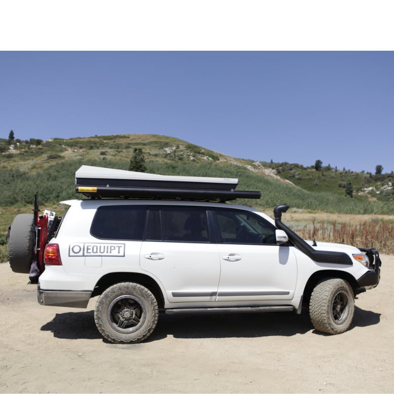 eezi-awn-series-2000-awning-close-side-view-black-hardcase-on-land-cruiser-in-nature