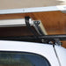 eezi-awn-series-3-soft-shell-roof-top-tent-beige-open-close-up-view-of-mounting-rail-system-on-vehicle-with-crossbars