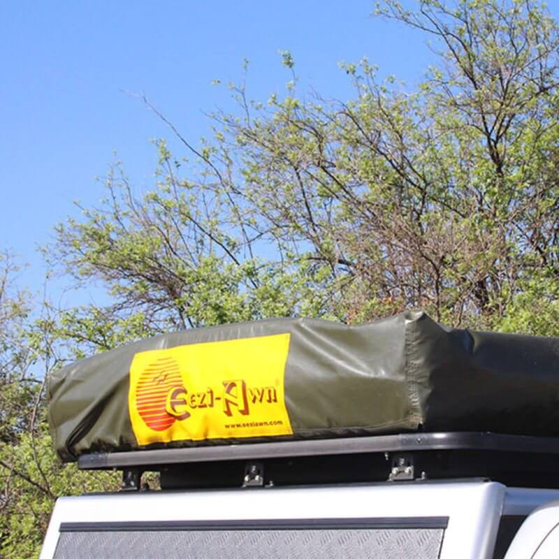 eezi-awn-series-3-soft-shell-roof-top-tent-closed-close-up-view-of travel-cover-on-vehicle-in-nature
