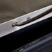 eezi-awn-series-3-soft-shell-roof-top-tent-olive-open-close-up-view-of-a-metal-eyelet-for-spring-steel-rods