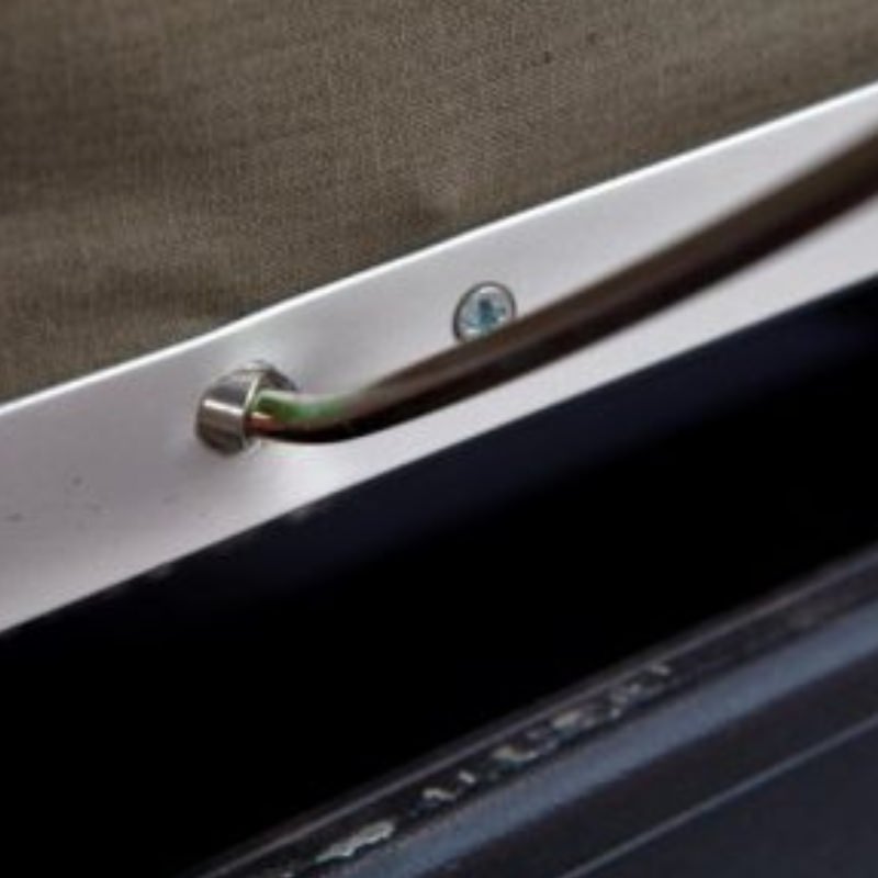 eezi-awn-series-3-soft-shell-roof-top-tent-olive-open-close-up-view-of-a-metal-eyelet-for-spring-steel-rods