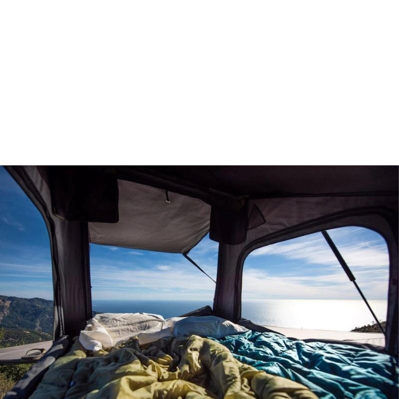 eezi-awn-stealth-hard-shell-roof-top-tent-open-interior-view-with-windows-and-entrance-opened-towards-nature