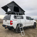 eezi-awn-stealth-hard-shell-roof-top-tent-open-rear-corner-view-with-pitched-rainfly-on-toyota-tundra-in-desert