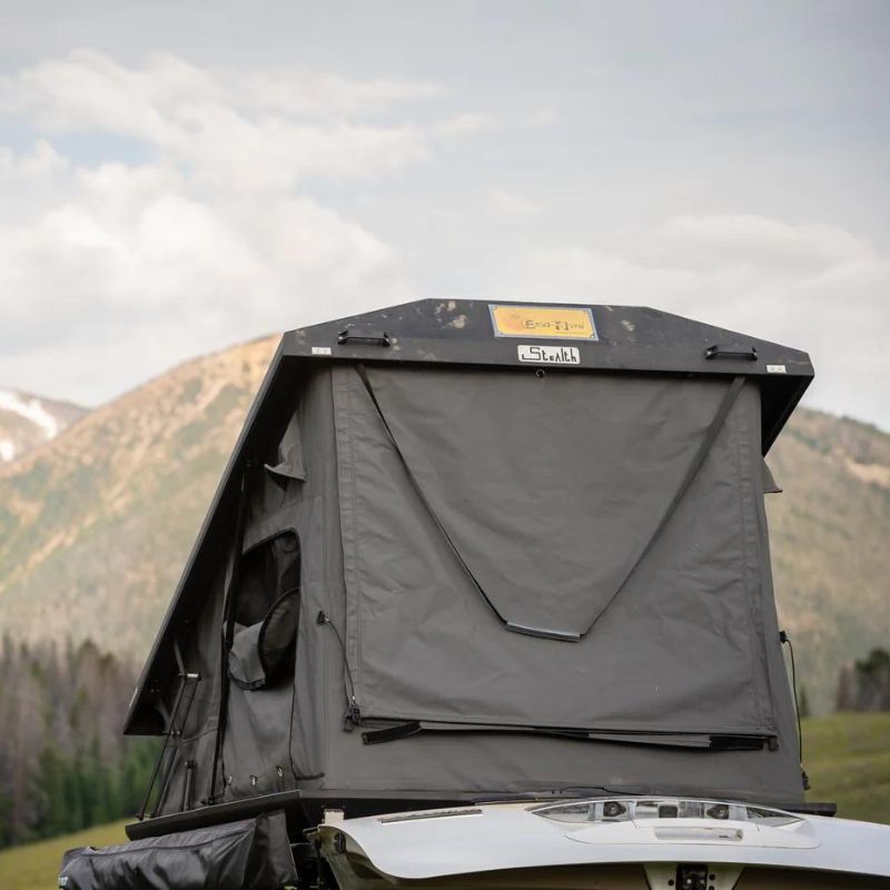 eezi-awn-stealth-hard-shell-roof-top-tent-open-rear-view-on-ford-explorer-in-nature