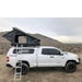 eezi-awn-stealth-hard-shell-roof-top-tent-open-side-view-with-pitched-rainfly-on-toyota-tundra-in-desert