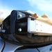 eezi-awn-swift-awning-beige-close-back-corner-view-close-up-on-vehicle-in-nature