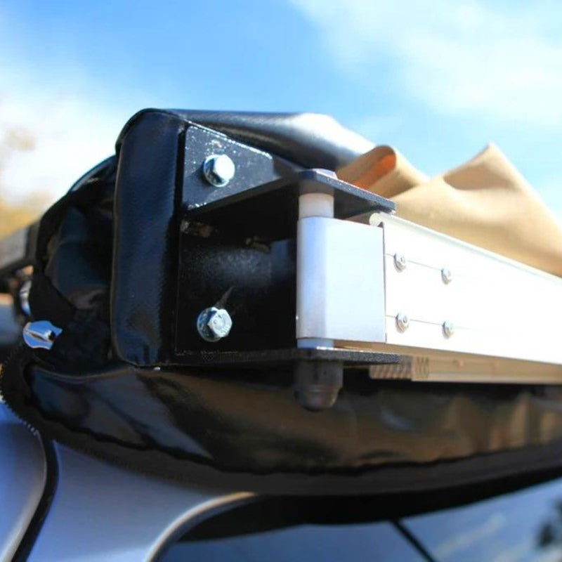 eezi-awn-swift-awning-beige-close-back-corner-view-close-up-on-vehicle-in-nature