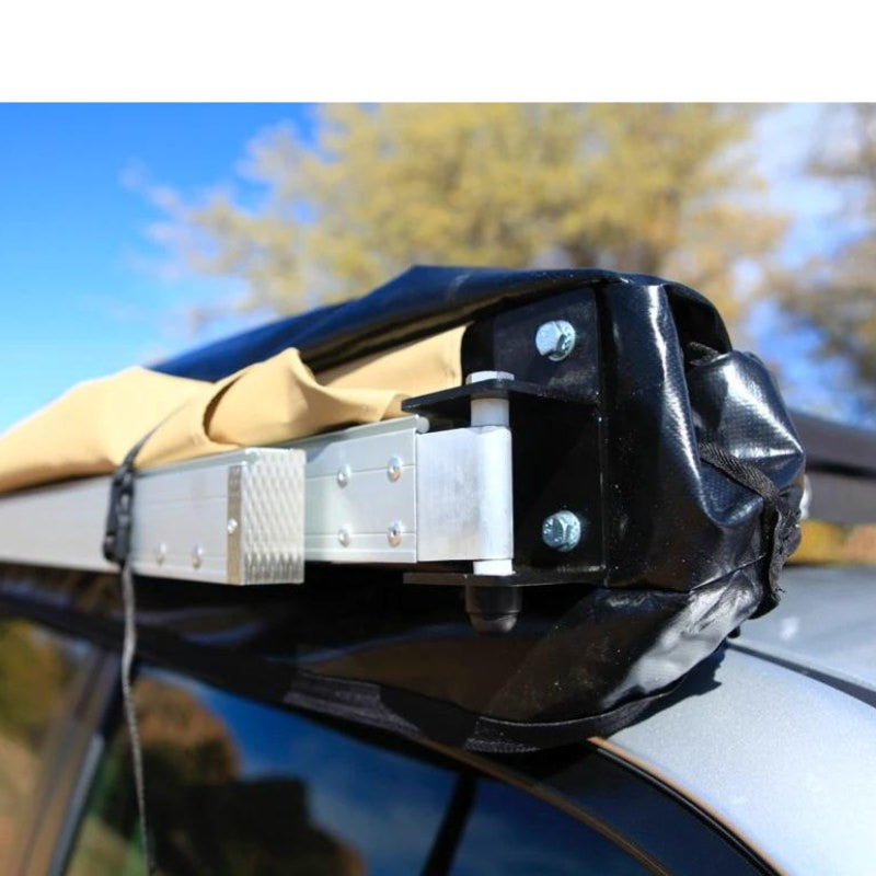 eezi-awn-swift-awning-beige-close-front-corner-view-close-up-on-vehicle-in-terrain