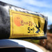 eezi-awn-swift-awning-beige-close-front-corner-view-close-up-on-vehicle-with-brand-logo-in-nature