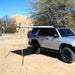 eezi-awn-swift-awning-beige-open-corner-side-view-on-toyota-4runner-in-terrain