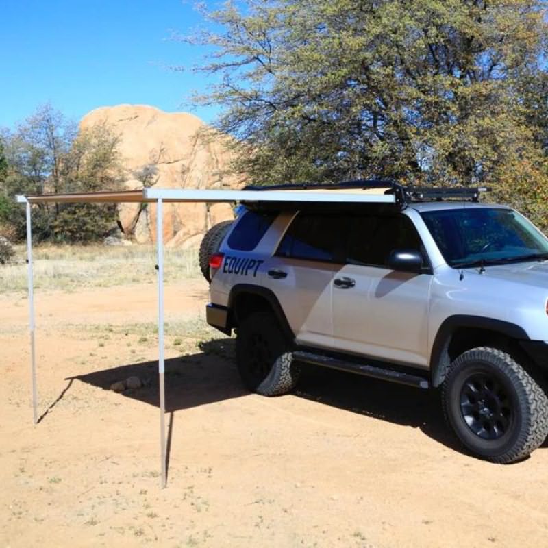 eezi-awn-swift-awning-beige-open-corner-side-view-on-toyota-4runner-in-terrain