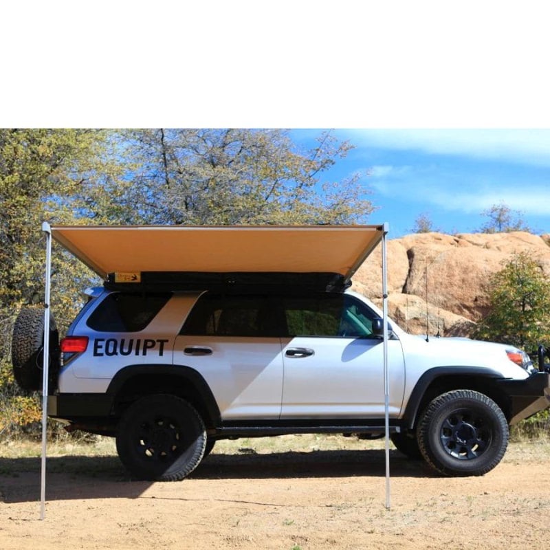 eezi-awn-swift-awning-beige-open-rear-side-veiw-on-toyota-4runner-in-nature